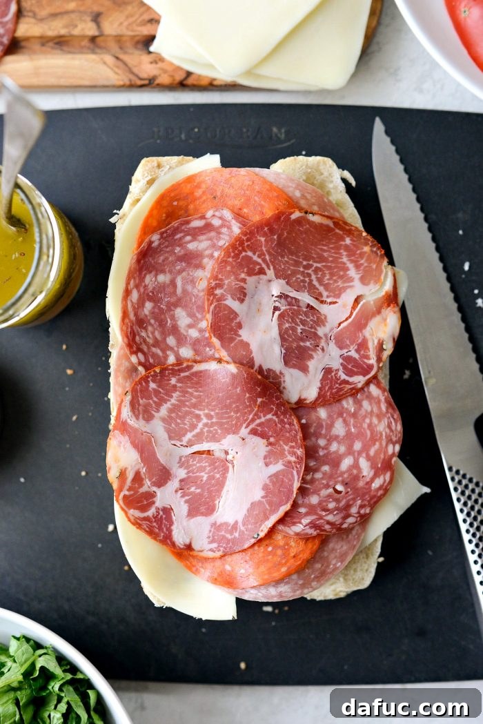 Zesty Italian Heroes 13 layer meats and cheeses onto sub bun