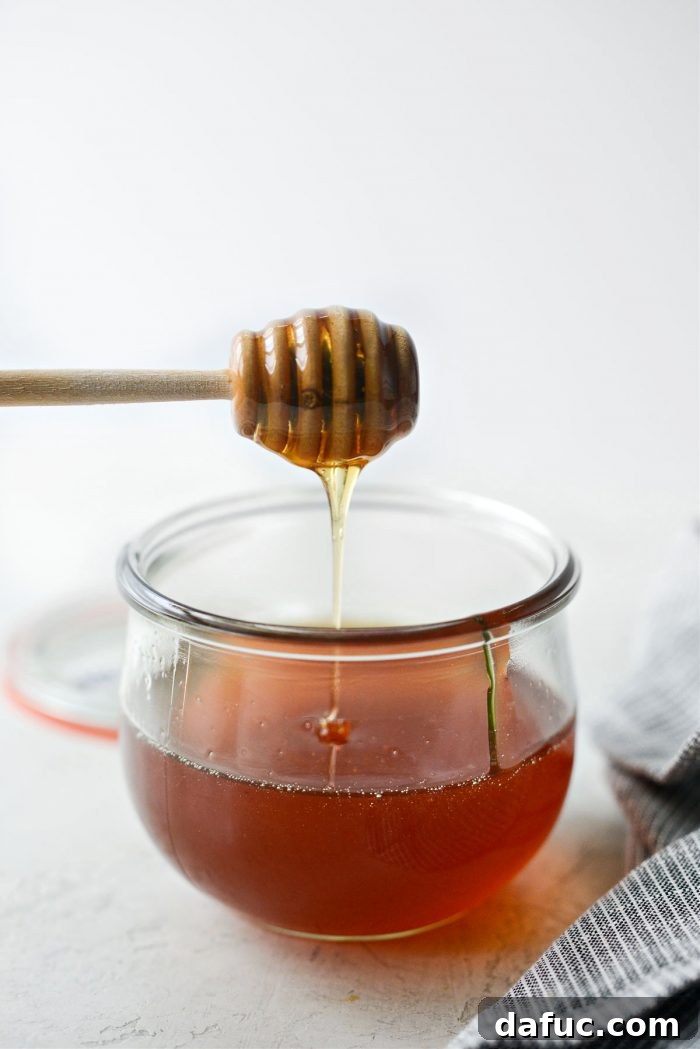 Sweet Heat Garlic Honey 19 A jar of Garlic Hot Honey ready to be used