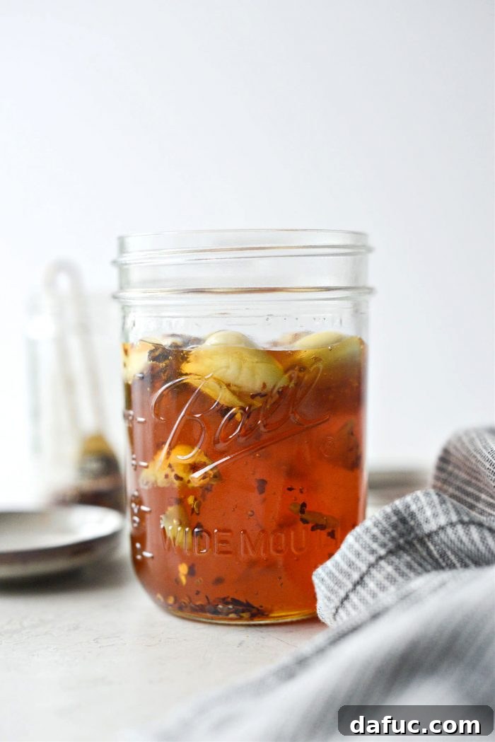 Sweet Heat Garlic Honey 9 Honey in a jar with garlic and red pepper flakes, ready for infusion