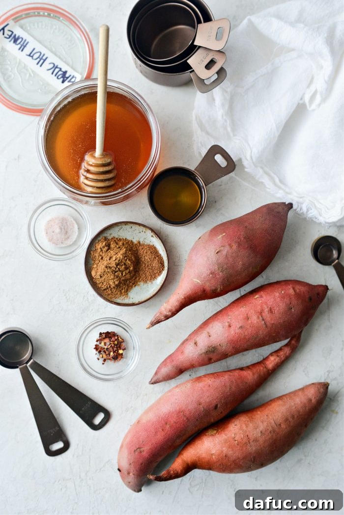 All the fresh ingredients for Cinnamon Roasted Hot Honey Sweet Potatoes neatly arranged