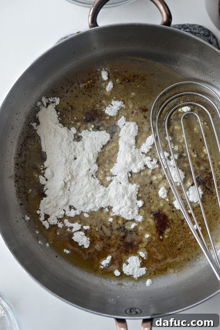 Butter and flavorful turkey drippings heating in a skillet for the gravy base