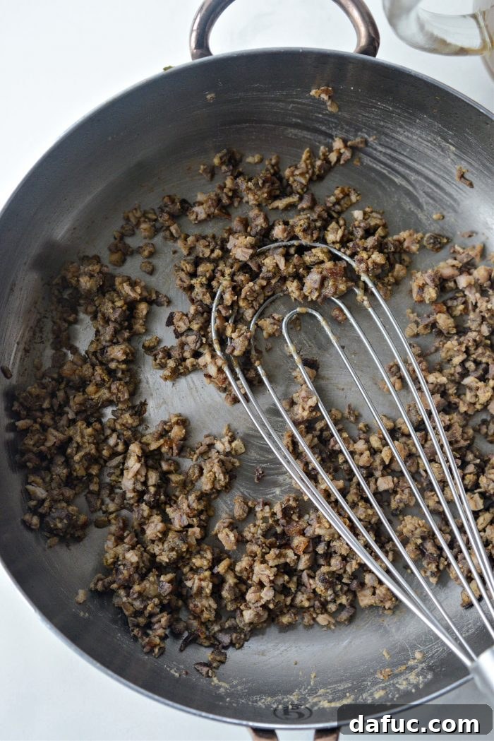 Adding finely minced turkey neck meat and giblets to the cooking roux
