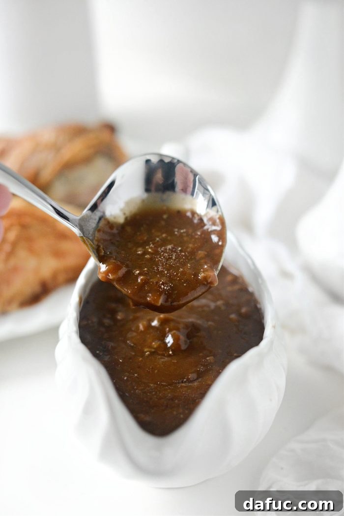 Elegantly presented homemade giblet gravy in a classic gravy boat, ready to serve