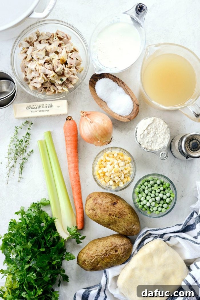 Close-up of the creamy, rich filling for homemade chicken pot pie, showing diced chicken and vegetables.