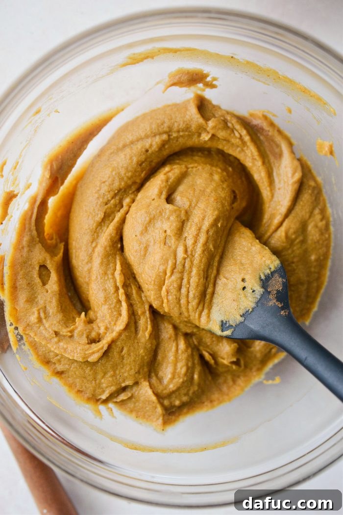 Spiced Pumpkin Pecan Brownies 17 Combining pumpkin batter