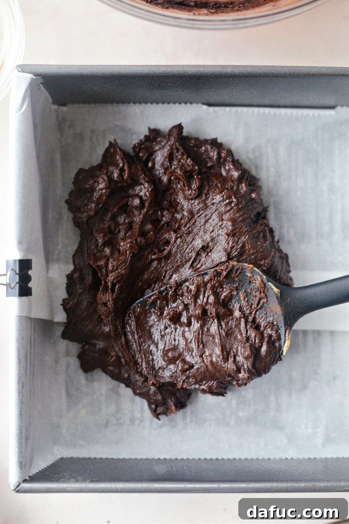 Spiced Pumpkin Pecan Brownies 19 Adding half of the brownie batter to the pan