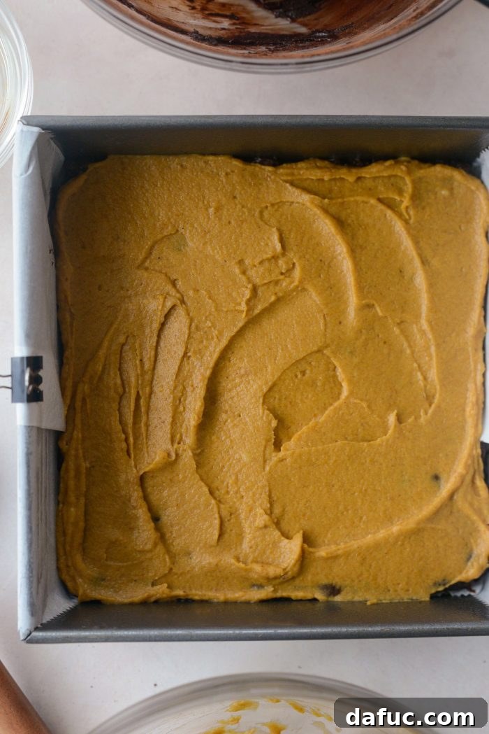 Spiced Pumpkin Pecan Brownies 21 Spreading the pumpkin mixture evenly