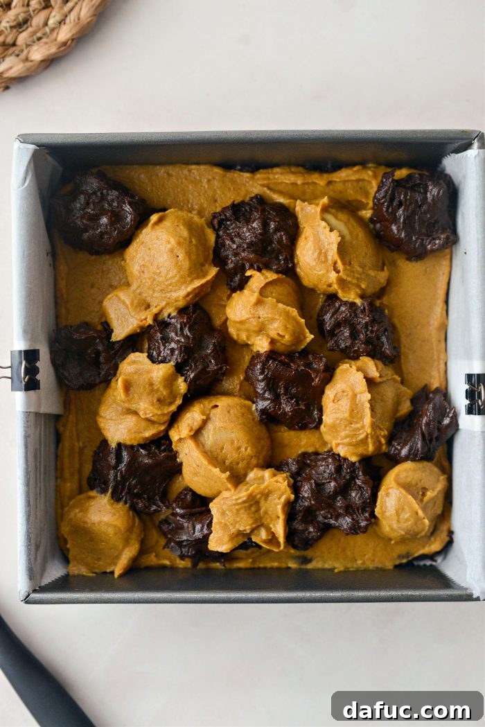 Spiced Pumpkin Pecan Brownies 22 Dropping dollops of both batters