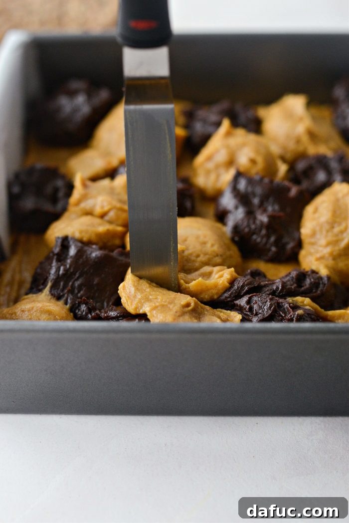 Spiced Pumpkin Pecan Brownies 23 Swirling batters with a knife