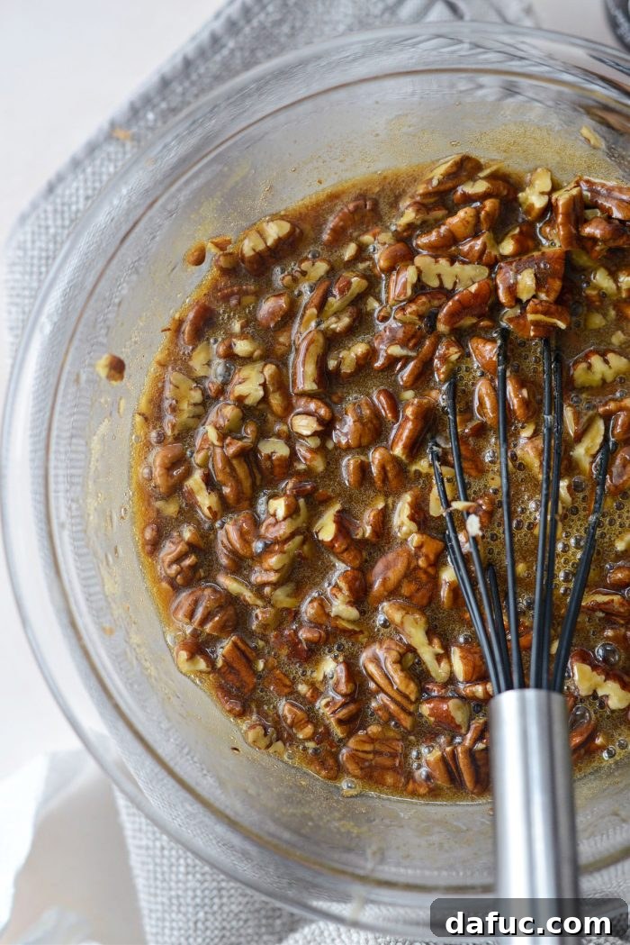 Spiced Pumpkin Pecan Brownies 30 Adding chopped pecans to the mixture