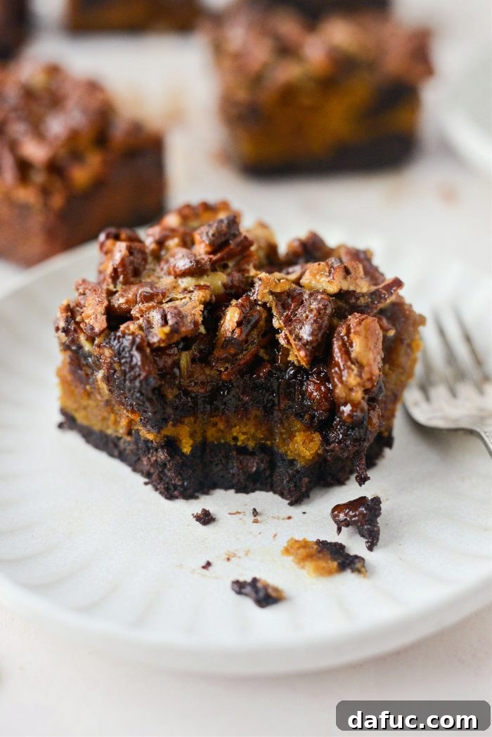 Spiced Pumpkin Pecan Brownies 38 A stack of Pumpkin Pecan Pie Brownies