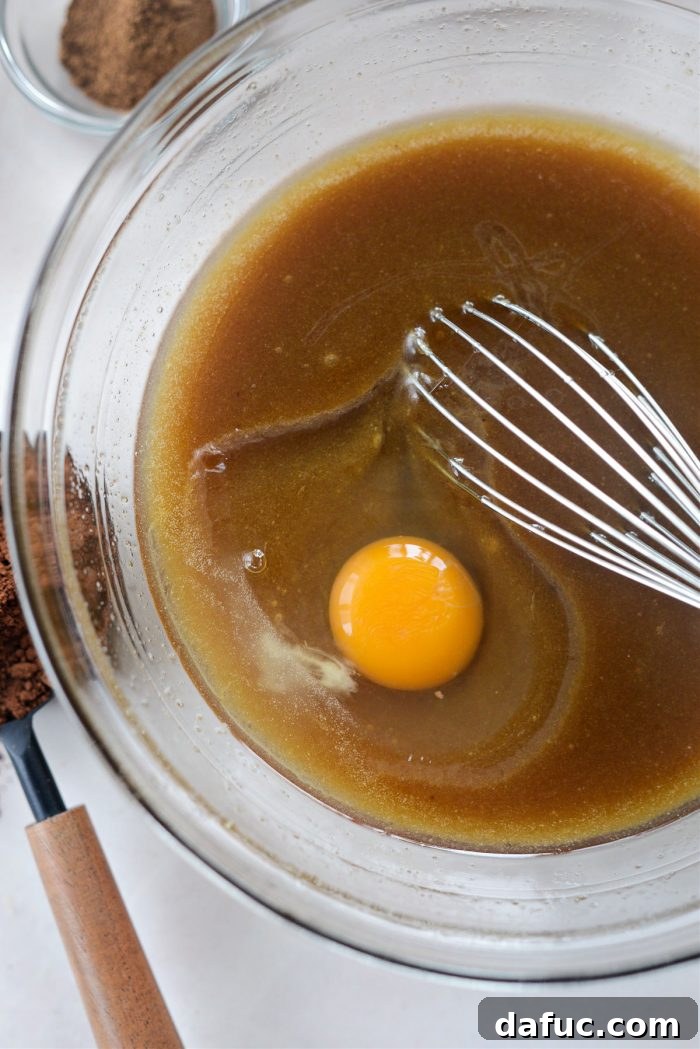 Spiced Pumpkin Pecan Brownies 10 Whisking in eggs one at a time