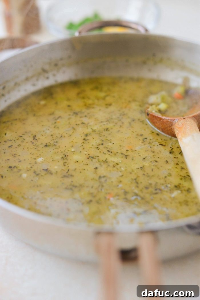Turkey stock and vegetables simmering until slightly thickened, forming the gravy base