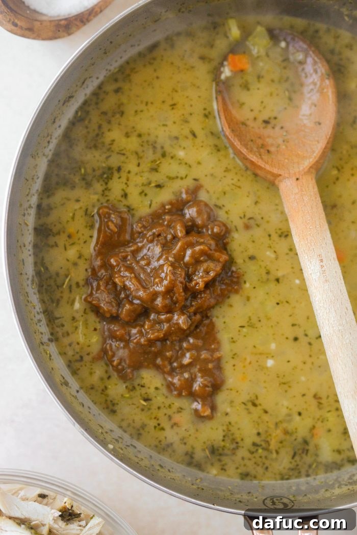 Adding leftover turkey gravy to the thickened vegetable mixture for a richer flavor