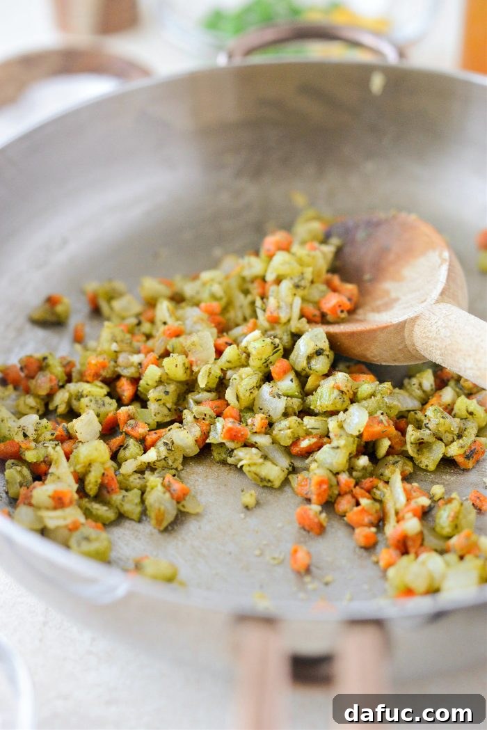 Stirring flour into the vegetable mixture and cooking for 1-2 minutes until lightly toasted