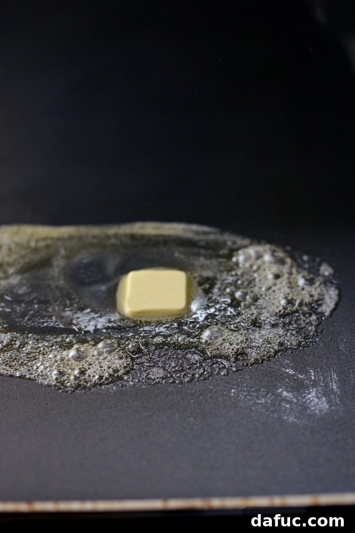 butter sizzling on a hot griddle.