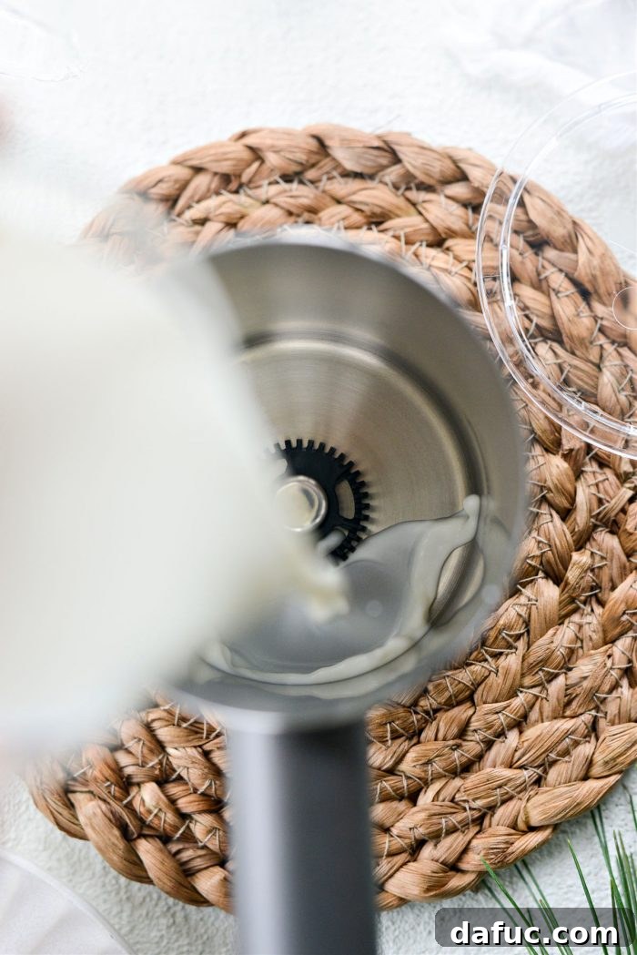 Adding milk to a frother