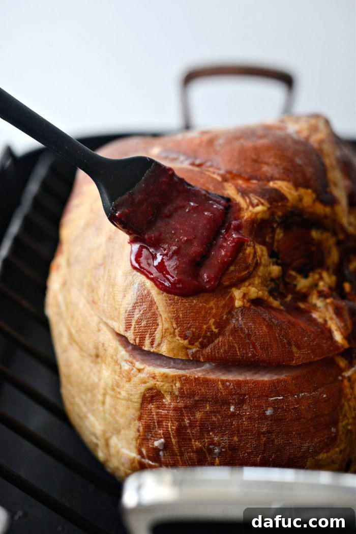 Glistening Cranberry Glazed Ham 14 brush and bake
