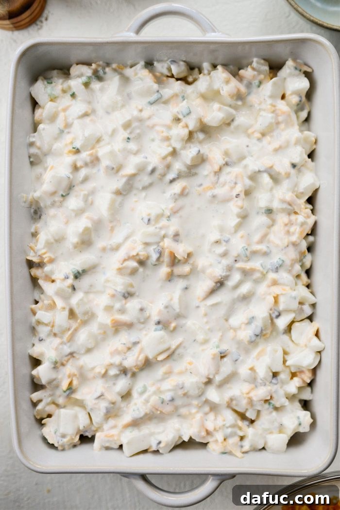 Mel's Golden Cheesy Potato Bake 15 transfer potato mixture to greased baking dish