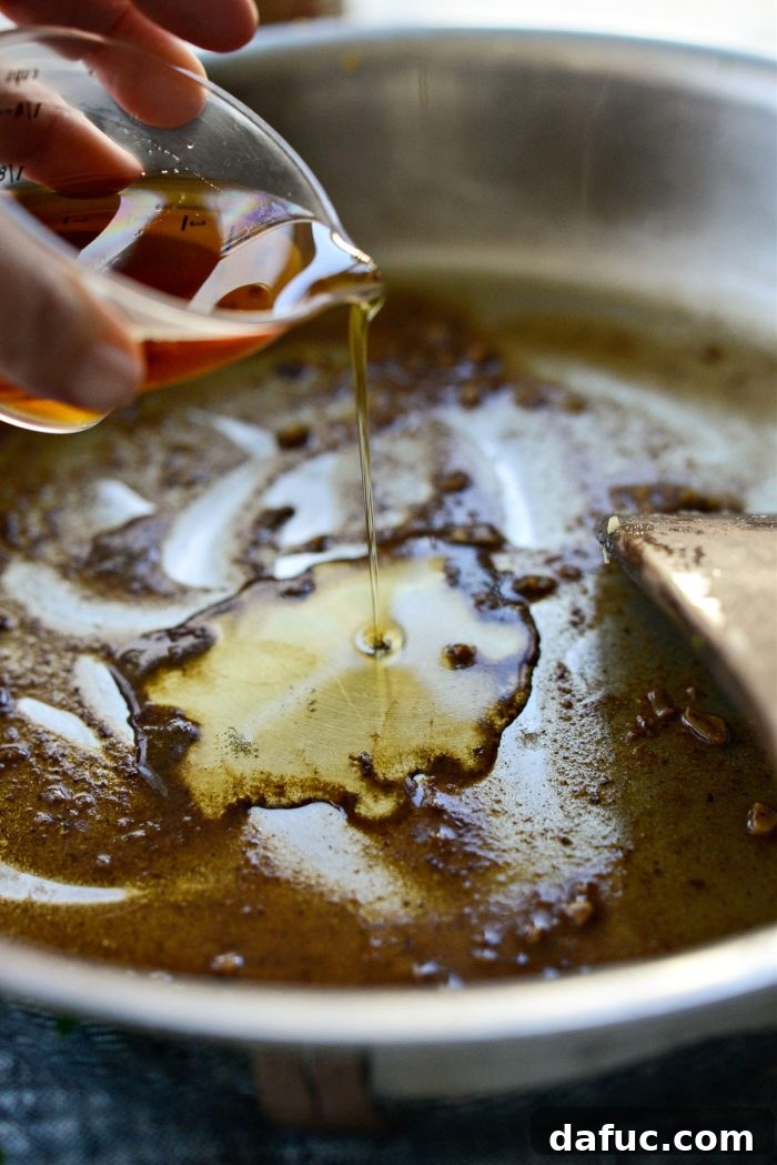 Decadent Maple Bourbon Bacon Brussels 14 Pure maple syrup added to the reduced bourbon in the skillet.