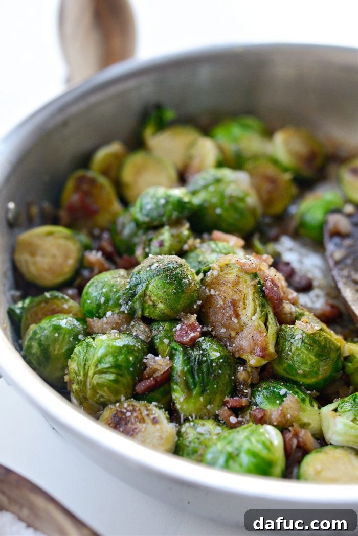 Decadent Maple Bourbon Bacon Brussels 16 Brussels sprouts being tossed in the glaze and seasoned with salt and pepper.