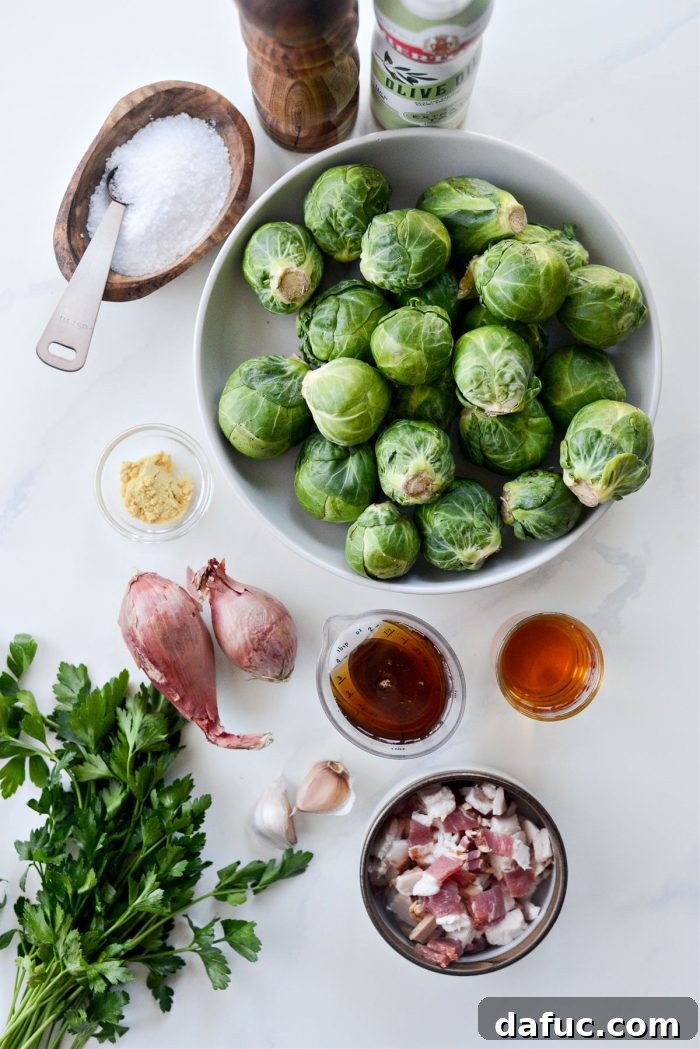 Decadent Maple Bourbon Bacon Brussels 4 Ingredients for Maple Bourbon Bacon Brussels Sprouts laid out on a counter, including fresh sprouts, bacon, shallots, and seasonings.