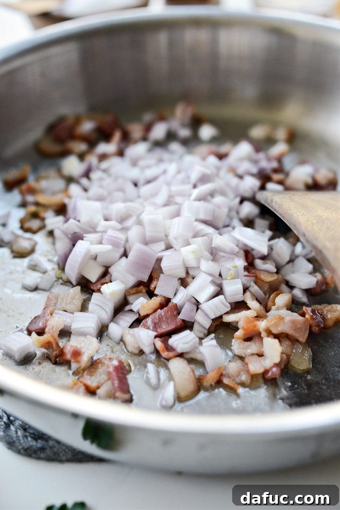 Decadent Maple Bourbon Bacon Brussels 6 Diced shallots added to the skillet with partially cooked bacon.