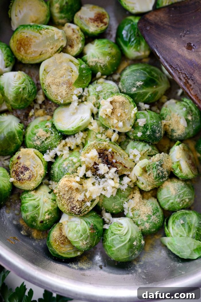 Decadent Maple Bourbon Bacon Brussels 9 Minced garlic and dry mustard added to the pan with partially cooked Brussels sprouts.