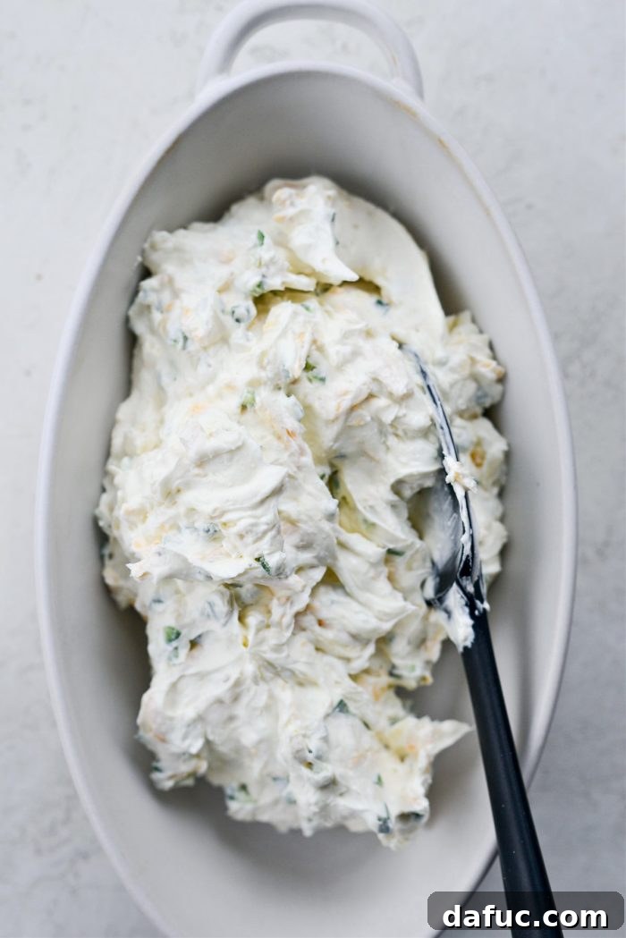 The Ultimate Jalapeño Popper Dip 10 Transferring the creamy jalapeño dip mixture into a 2-quart baking dish