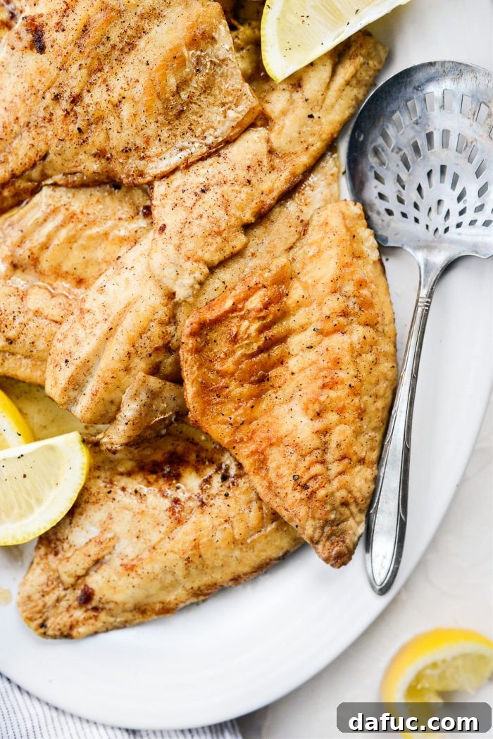 Pan-Seared Perch with Lemon Brown Butter 16 Squeezing lemon over Lemon Brown Butter Perch