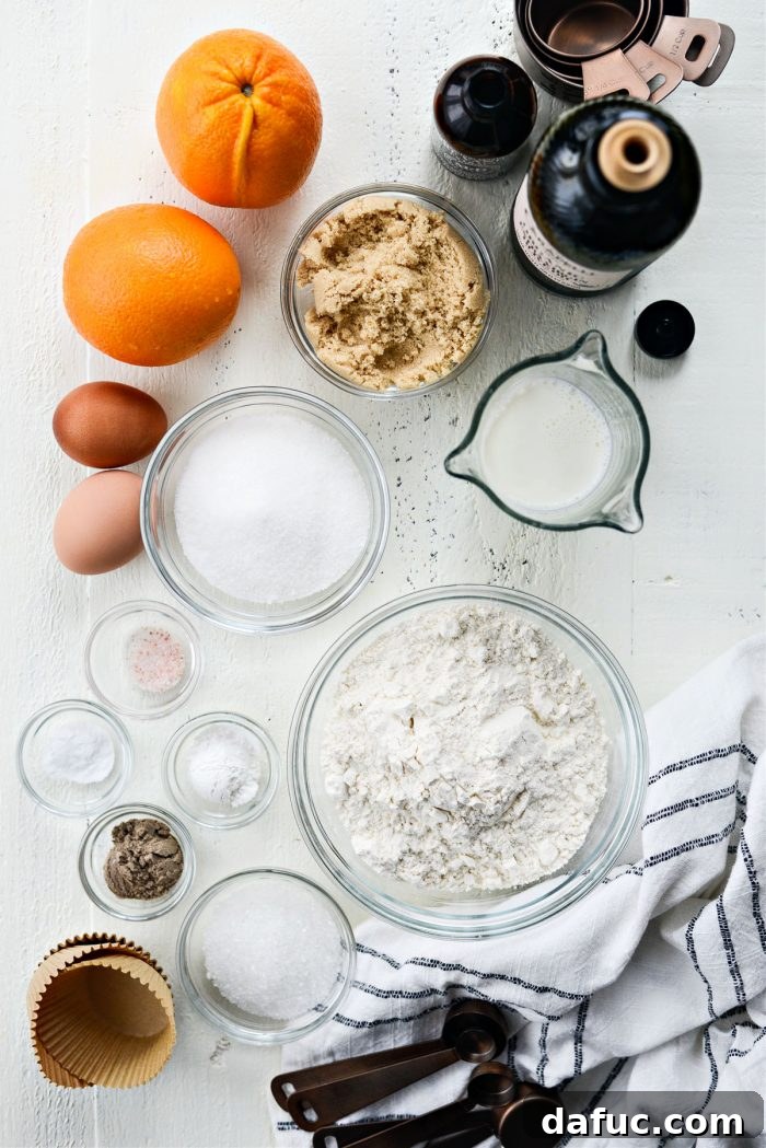 Fragrant Orange Cardamom Gems 4 Ingredients for making homemade Orange Cardamom Muffins laid out