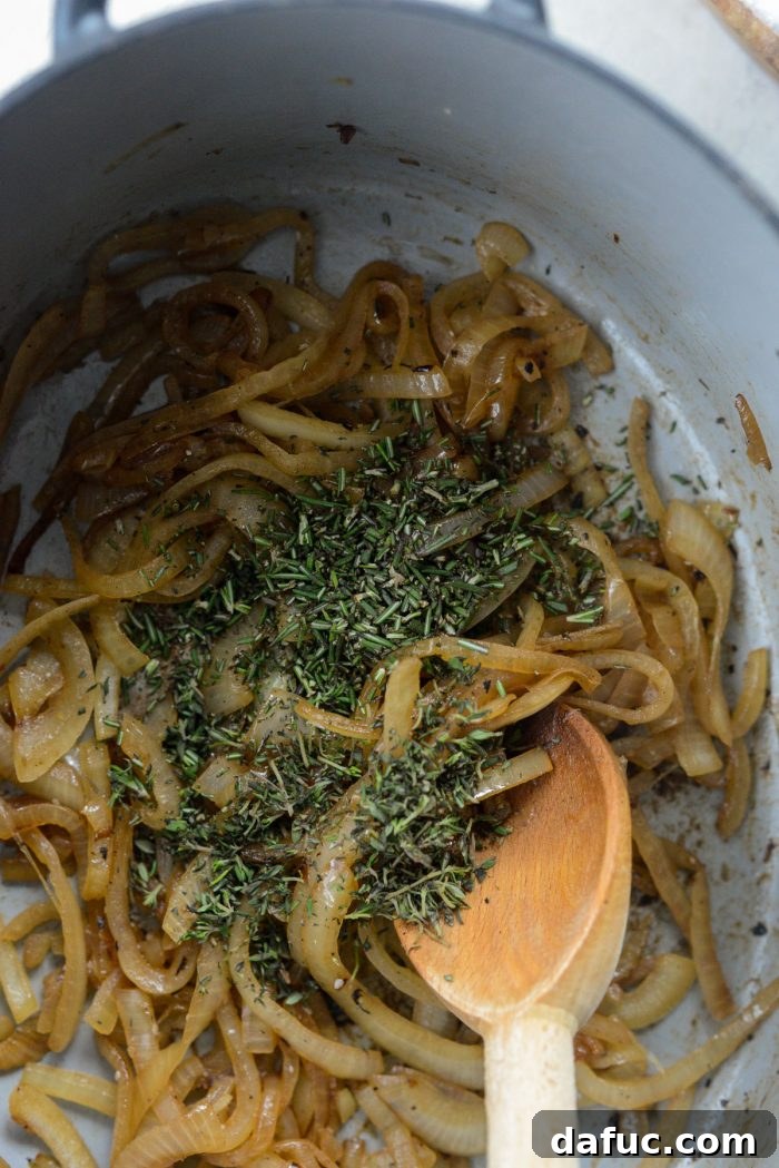 Golden Roasted Parsnip Puree 12 Fresh minced rosemary and thyme being added to sautéed onions.
