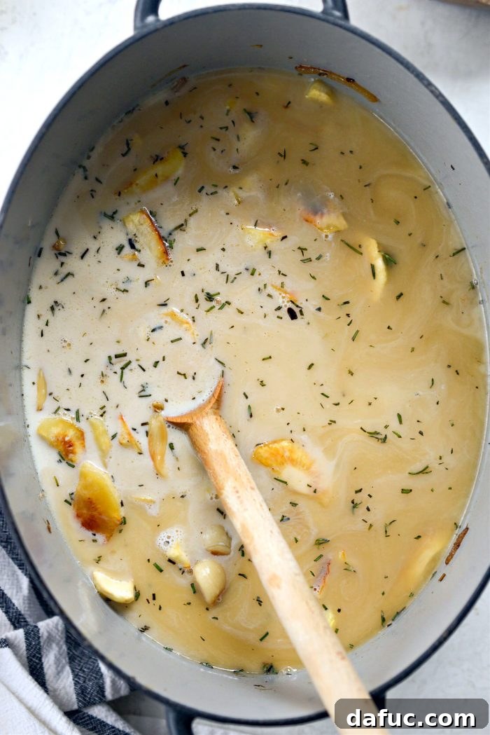 Golden Roasted Parsnip Puree 16 Ingredients in the Dutch oven, stirred to combine before blending.