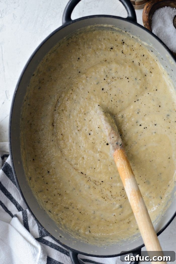 Golden Roasted Parsnip Puree 17 Using a stick blender to puree the soup directly in the Dutch oven.