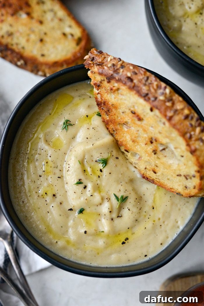 Golden Roasted Parsnip Puree 19 Another close-up of Creamy Roasted Parsnip Soup in a bowl, highlighting its creamy texture.