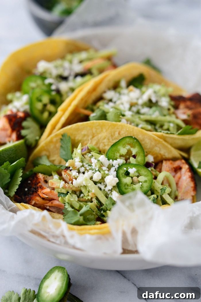Spicy Salmon Street Tacos 3 Close-up of Blackened Salmon Tacos with avocado broccoli slaw and cotija cheese