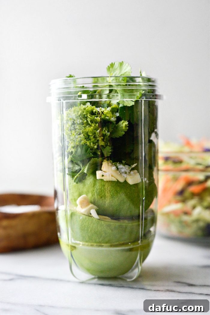 Spicy Salmon Street Tacos 5 Making avocado slaw dressing in a blender