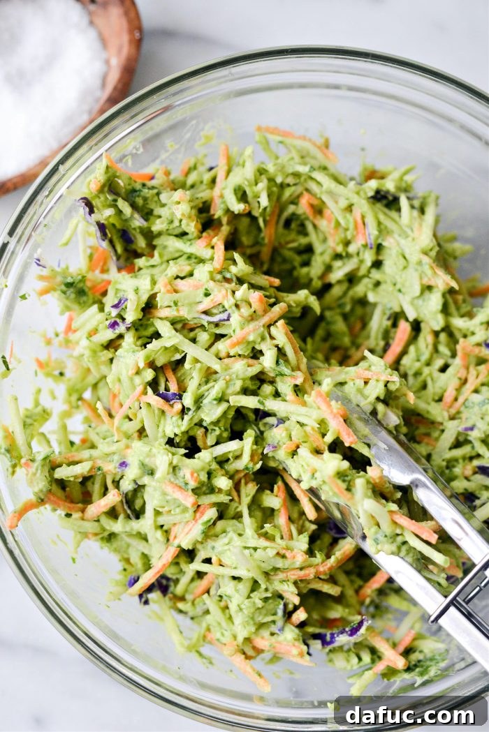 Spicy Salmon Street Tacos 8 Tossing avocado broccoli slaw to combine dressing
