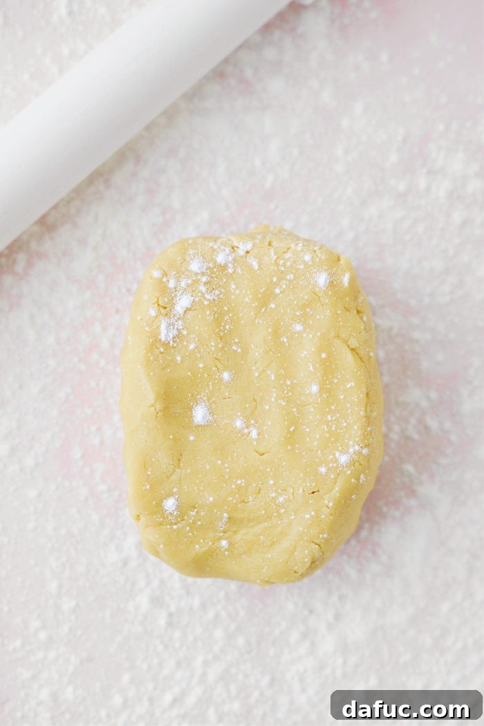 Jam Filled Butter Heart Cookies 10 Cookie dough rolled out evenly on a lightly floured surface, ready for cutting.