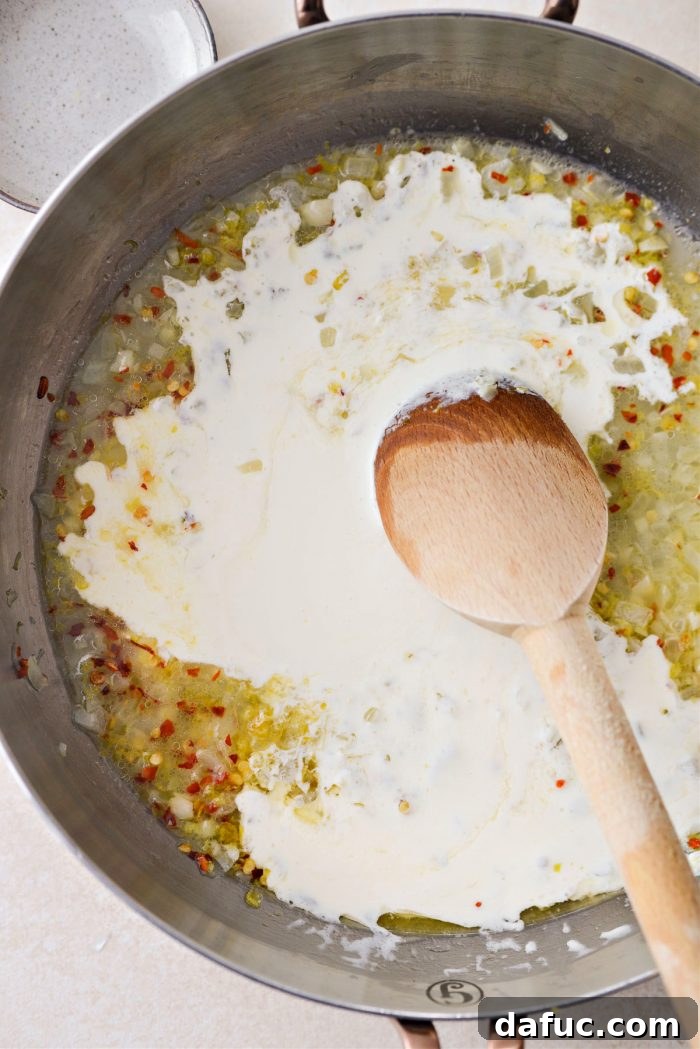 Velvety Lemon Parmesan Pasta 12 Cream sauce simmering in a skillet