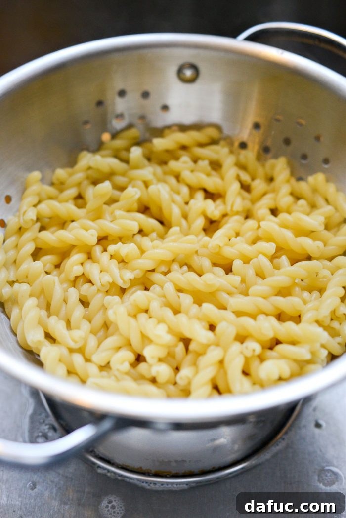 Velvety Lemon Parmesan Pasta 13 Draining cooked pasta