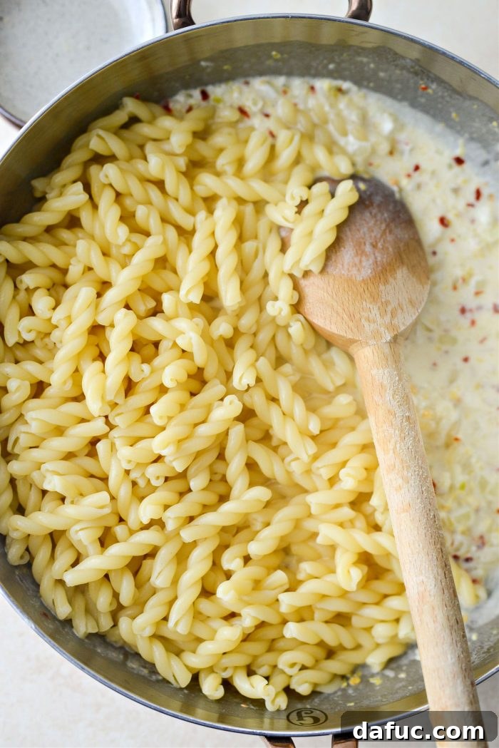 Velvety Lemon Parmesan Pasta 14 Cooked pasta added to the cream sauce in the skillet