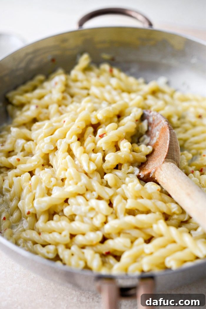 Velvety Lemon Parmesan Pasta 17 Seasoning the combined pasta and sauce