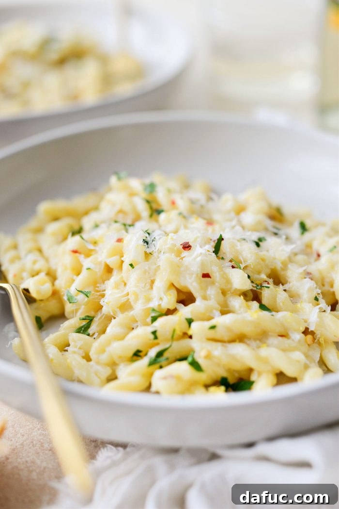 Velvety Lemon Parmesan Pasta 18 Creamy Lemon Parmesan Pasta served in a bowl