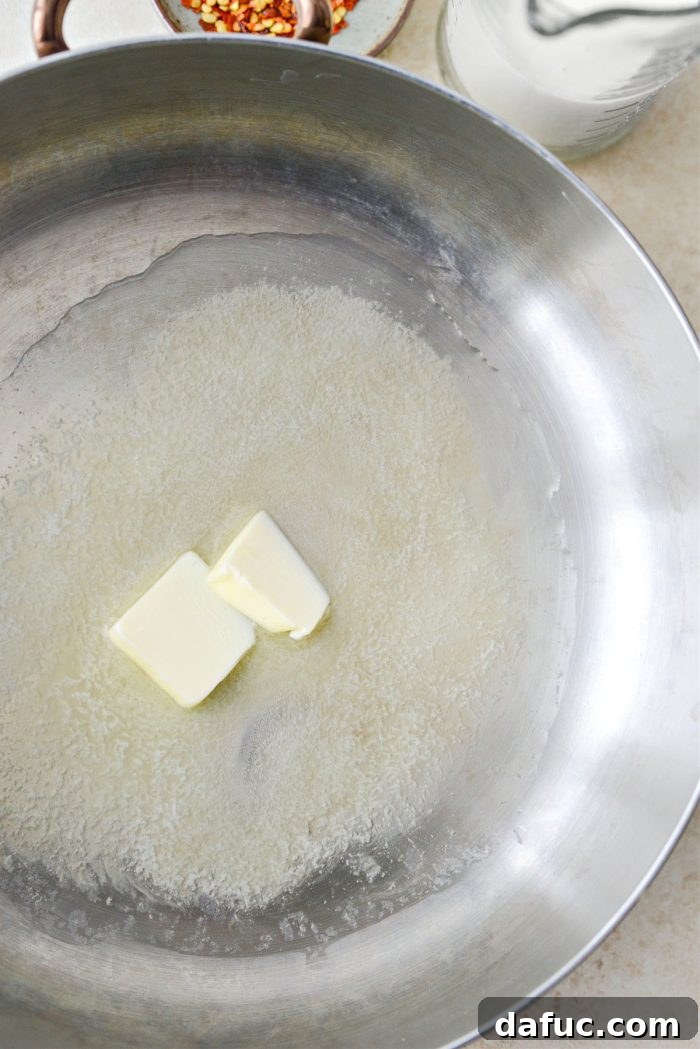 Velvety Lemon Parmesan Pasta 7 Olive oil and butter melting in a skillet