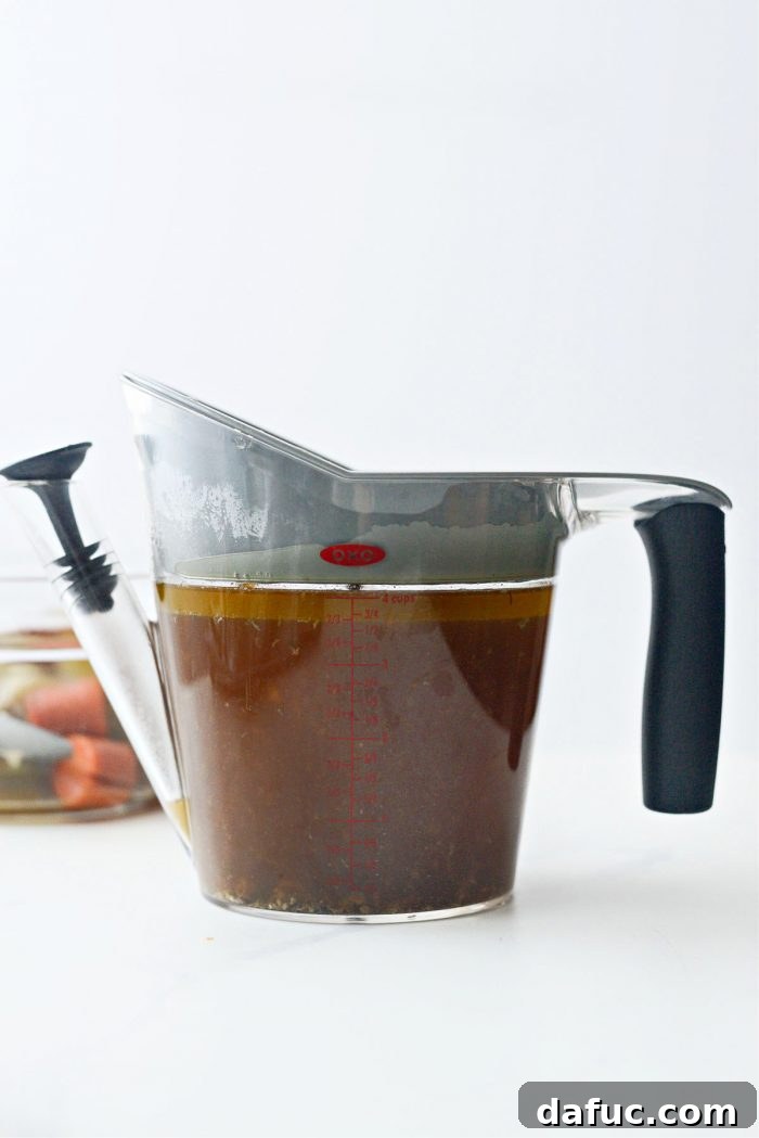 Fall-Off-The-Bone Slow Cooker Chicken 12 Separated cooking liquids and fat from slow cooker chicken