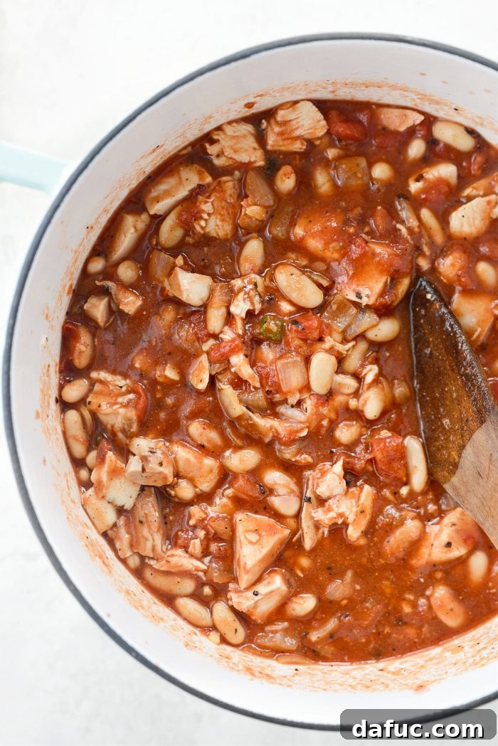 Zesty Buffalo Chicken Chili 12 Stirring chicken and beans into the chili