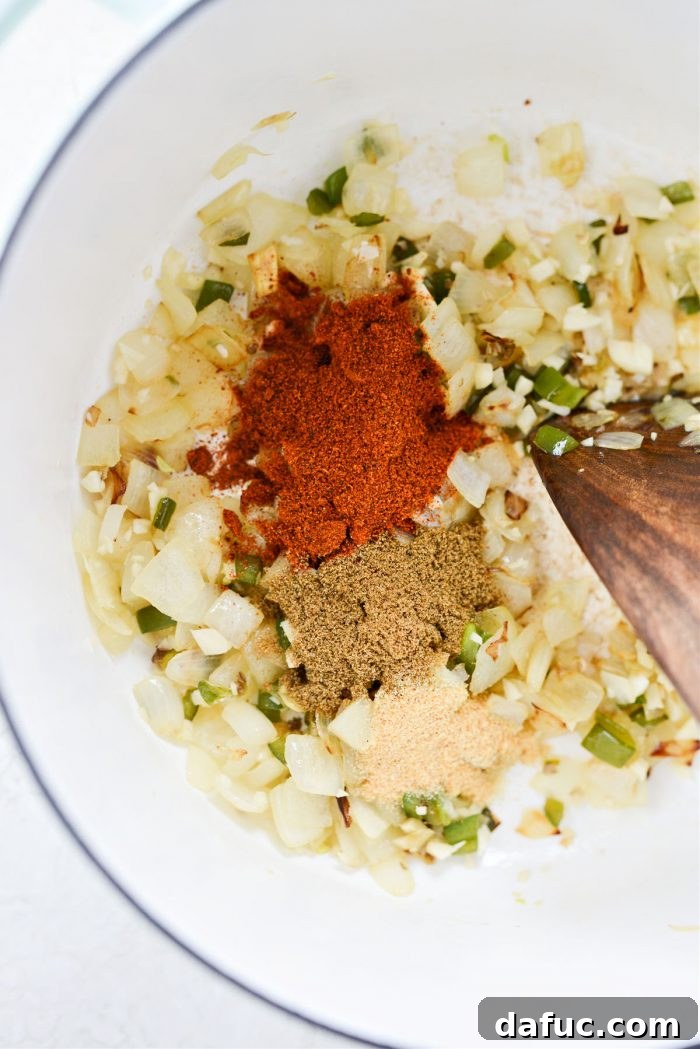 Zesty Buffalo Chicken Chili 8 Chili powder, cumin, garlic powder, and cayenne pepper added to the pot