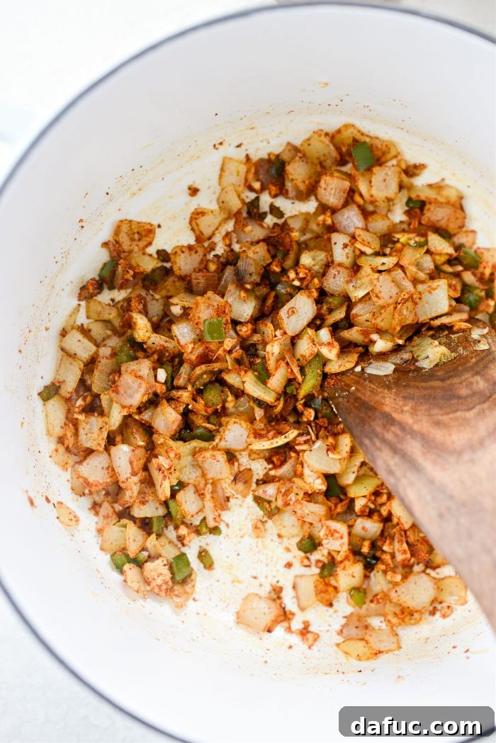 Zesty Buffalo Chicken Chili 9 Stirring the spices into the aromatic base
