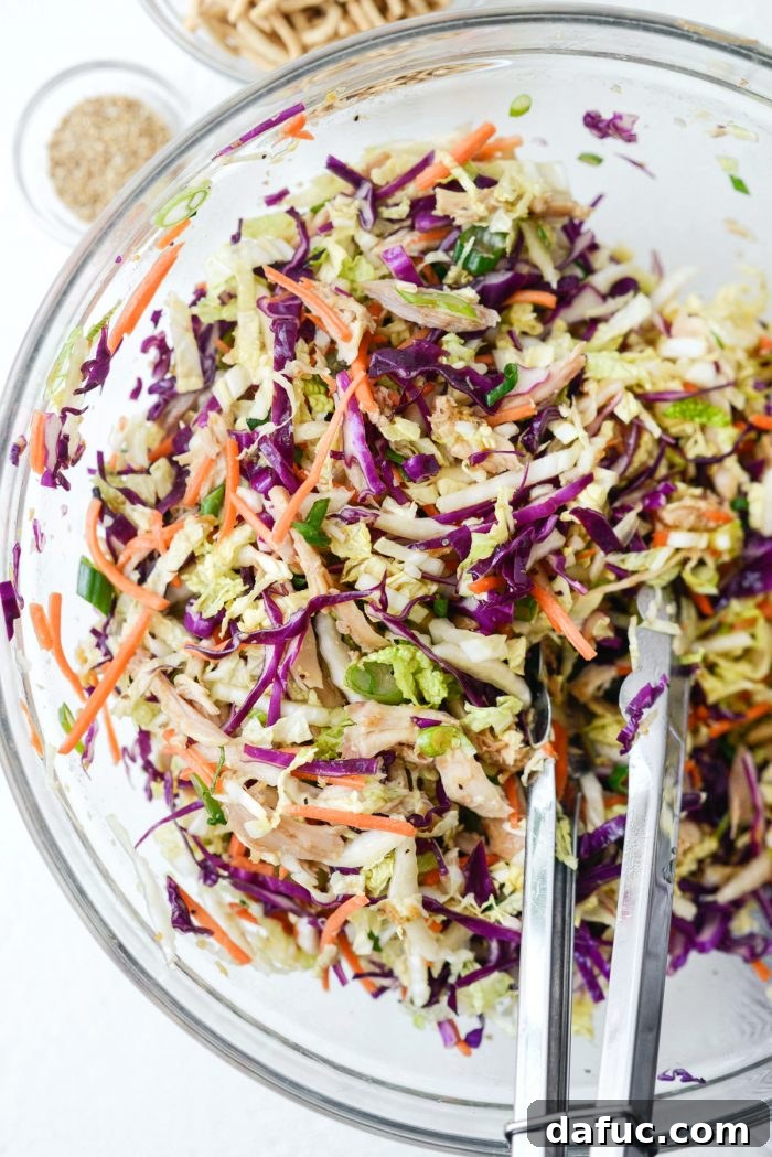 Crunchy Asian Chicken Salad 10 Tossing the Chinese Chicken Salad to ensure all ingredients are coated with dressing